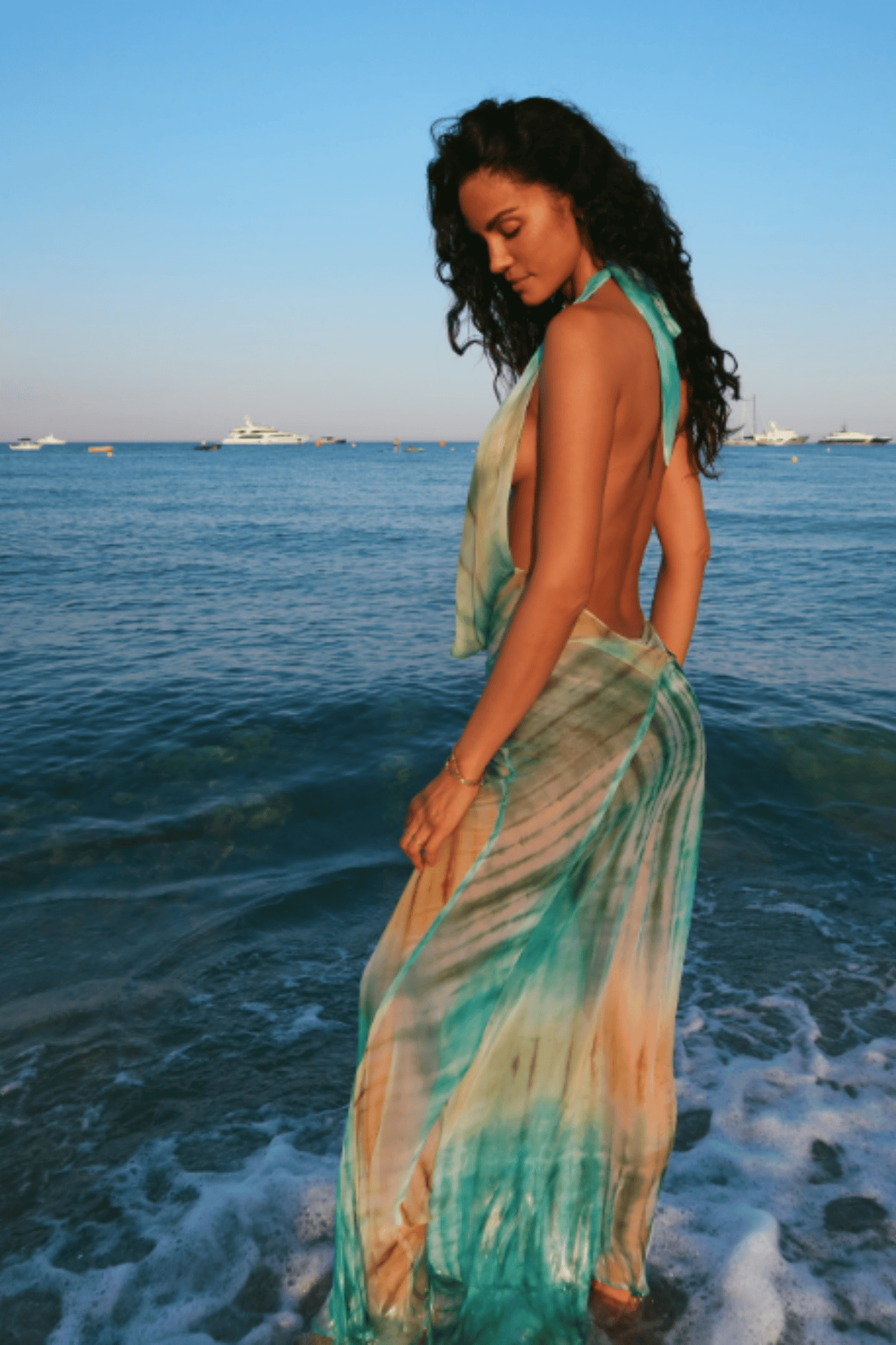 Flowing printed maxi dress styled for a beach wedding guest