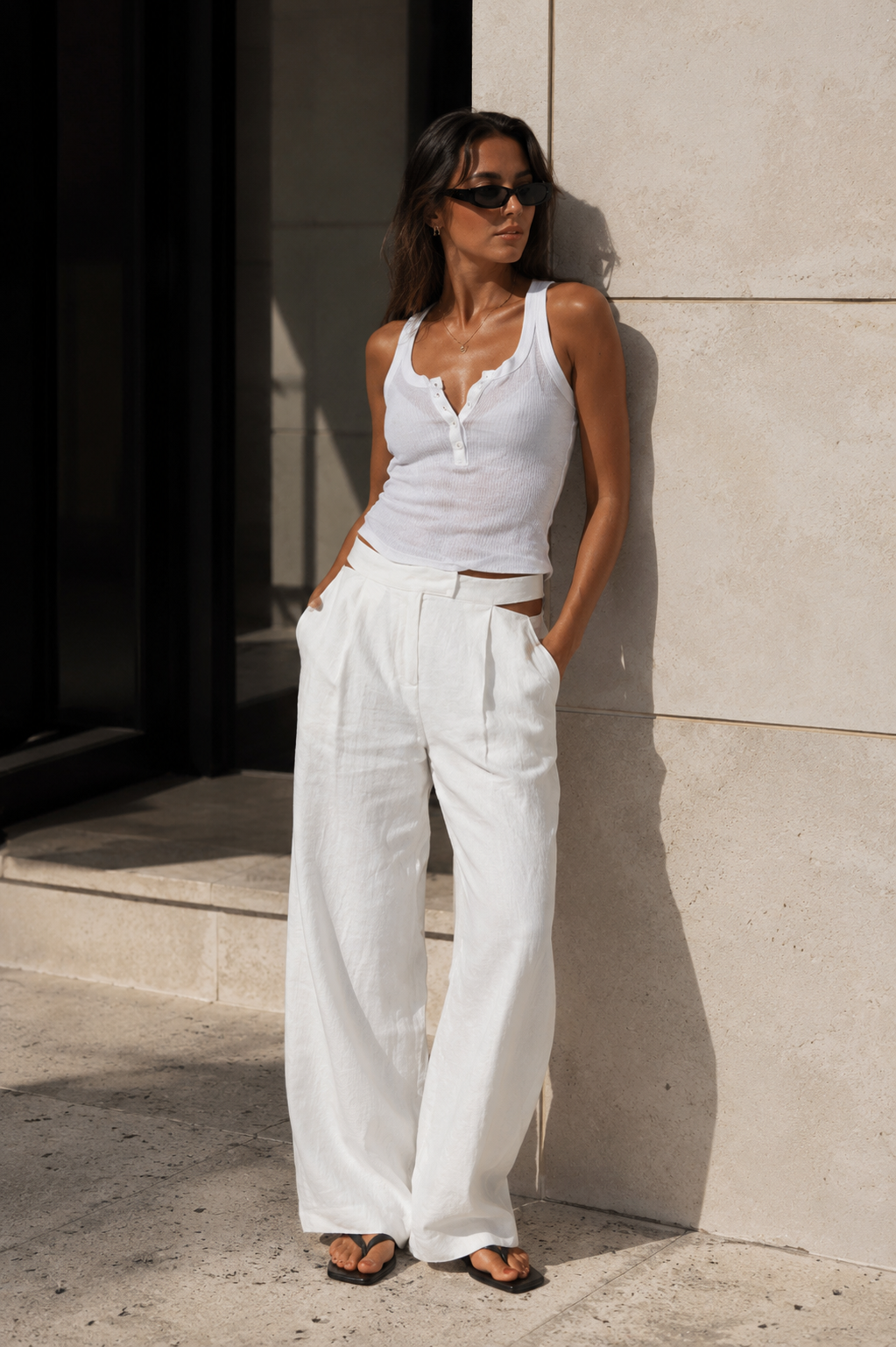 White linen pants from Chosen by Tuchuzy, styled for spring in Bondi Beach