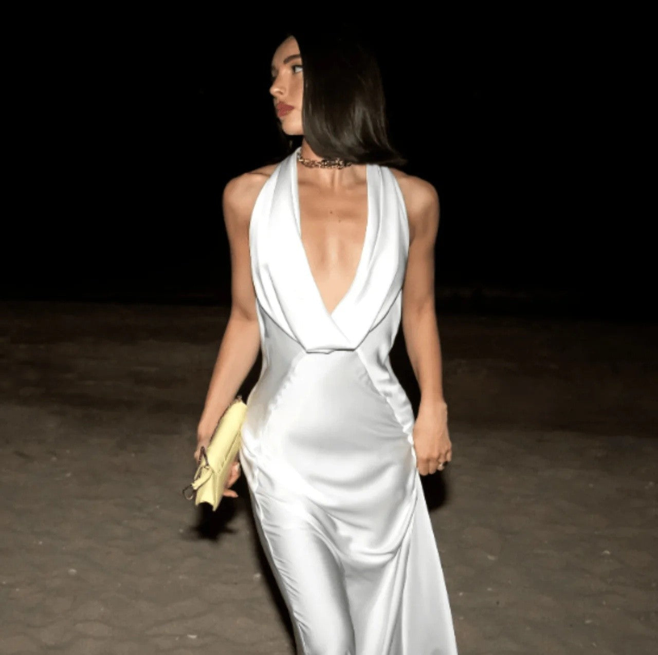 woman wearing a beautiful white gown to show the difference between semi-formal vs formal dresses